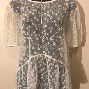 Cream sheer shell with small flower detail